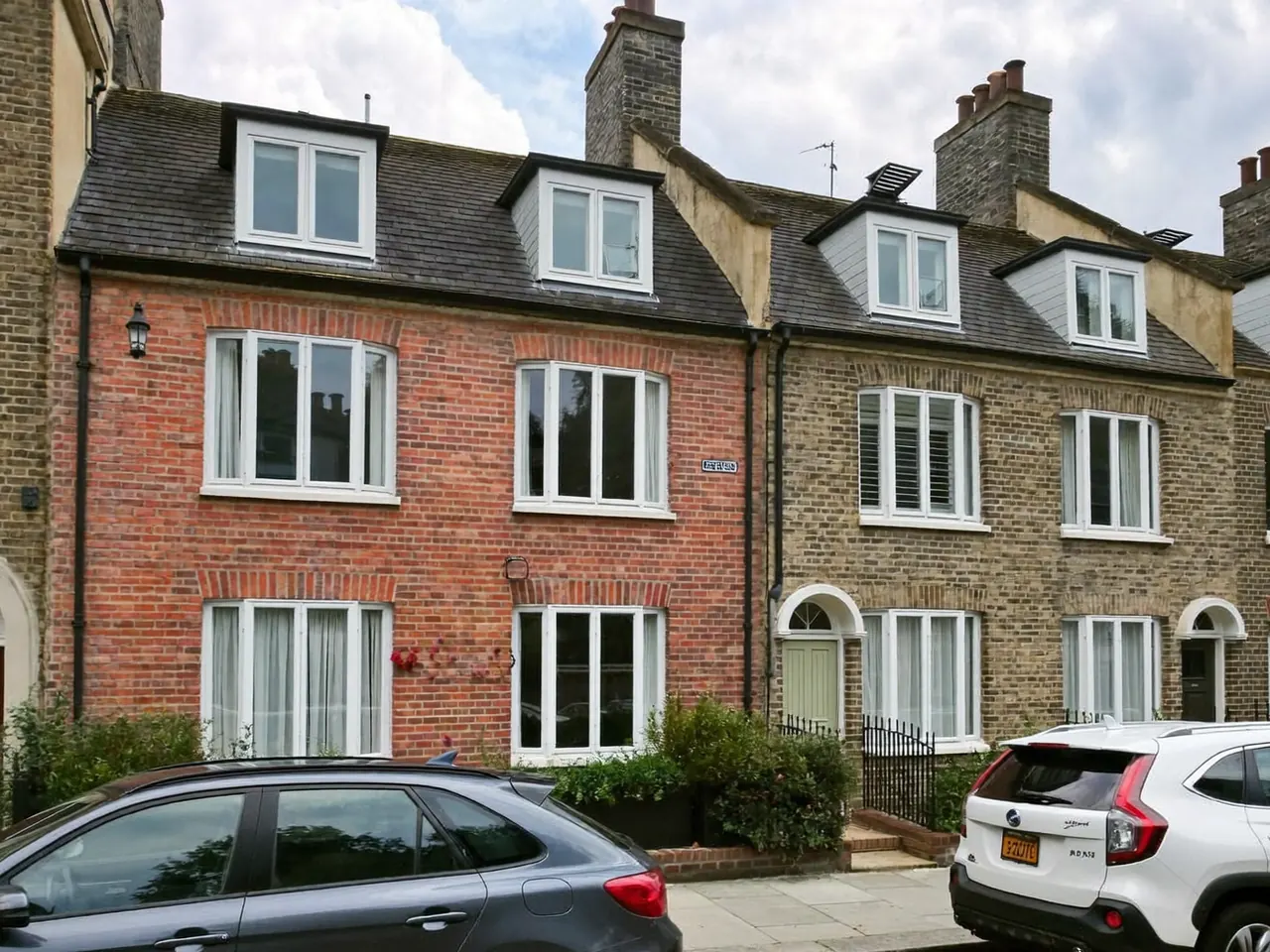 Newly installed sash windows on a rendered home