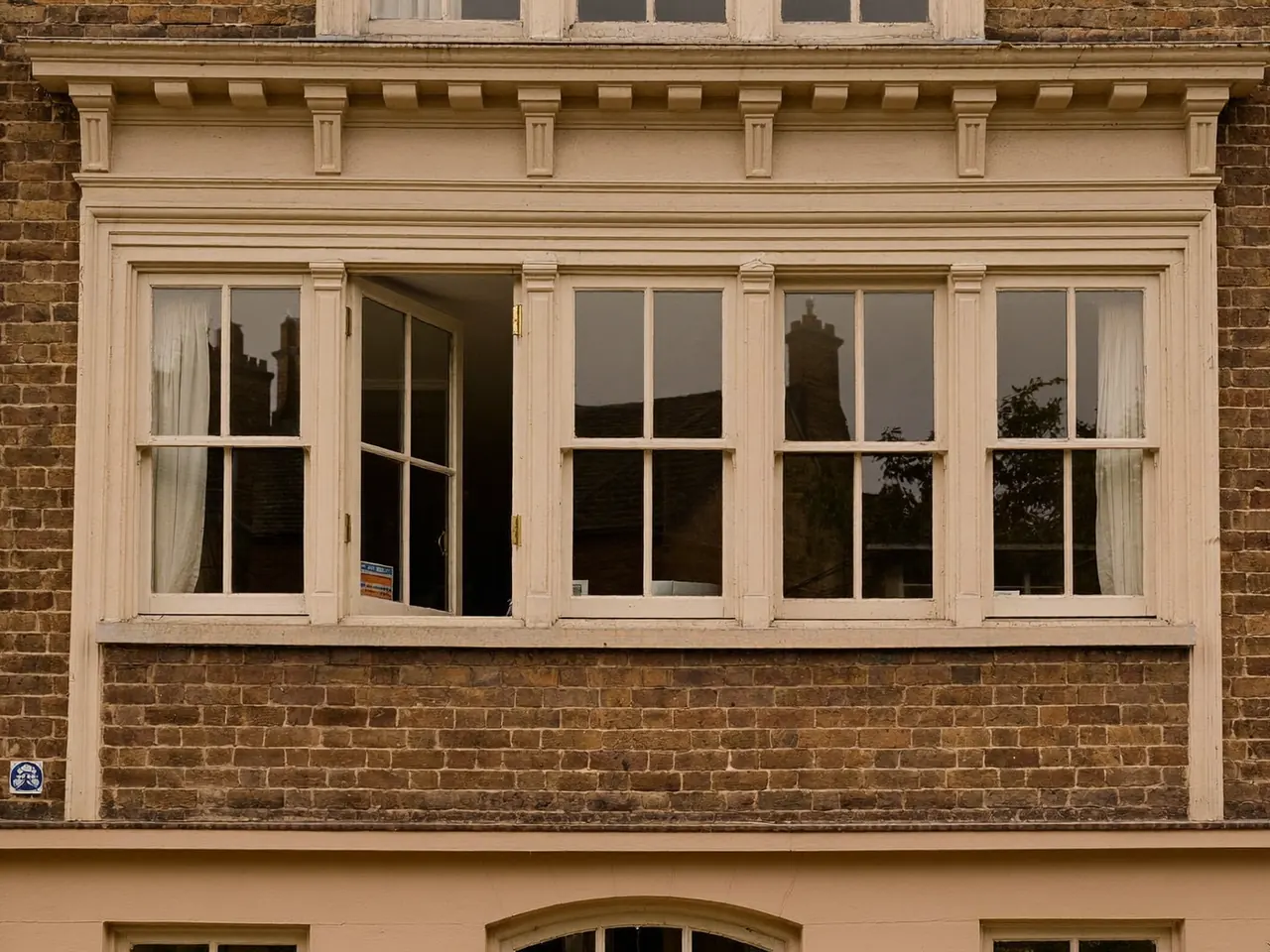 Two-over-two sash windows on a period home facade
