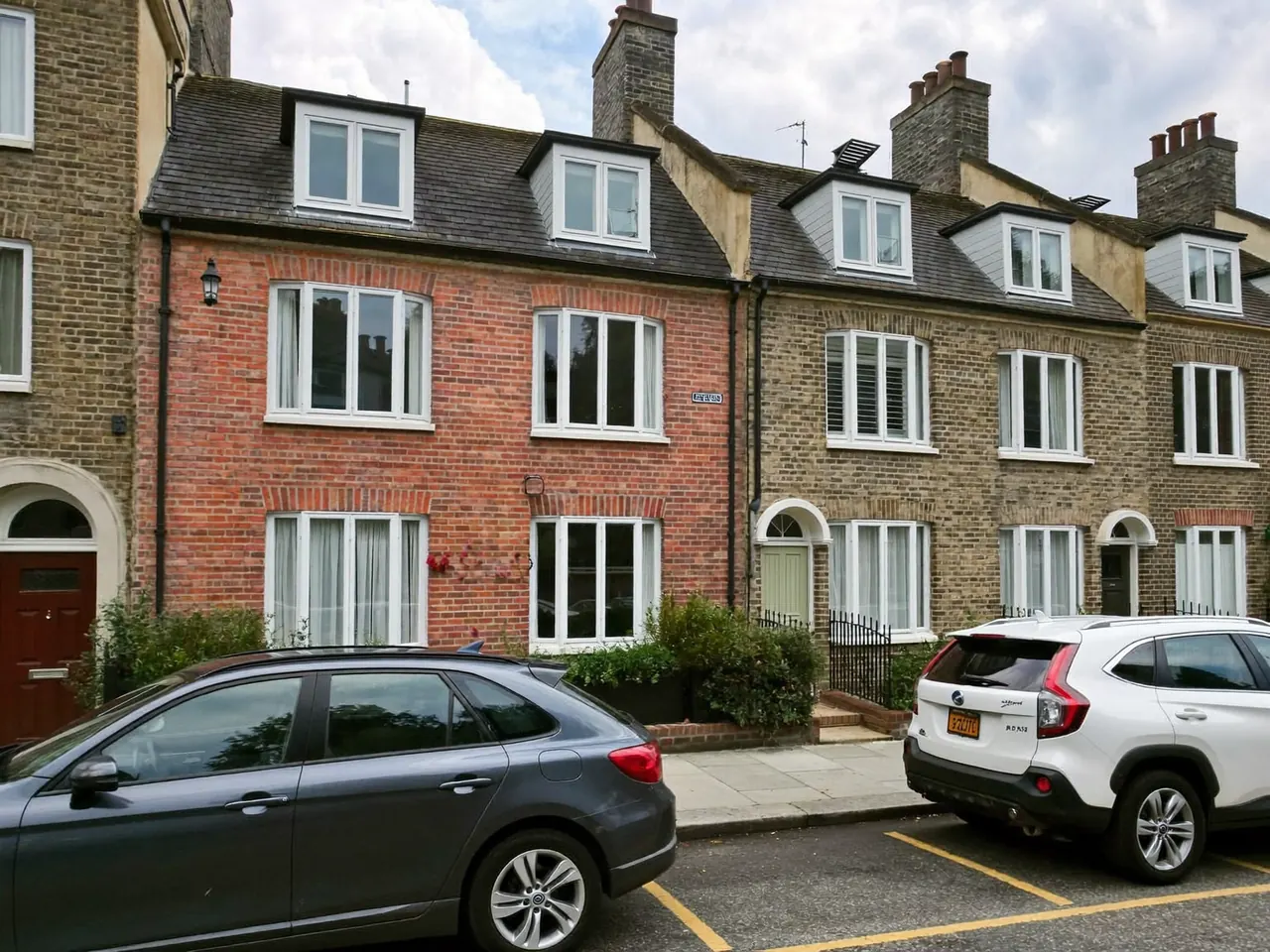 Period terraced houses with white timber sash windows
