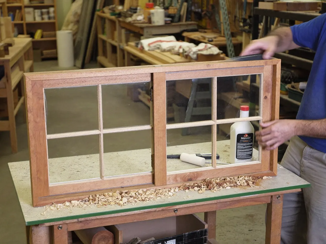 A sash window being restored on a workshop bench